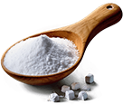 Sodium bicarbonate, white powder in a wooden spoon
